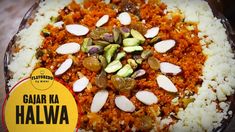 there is a dish with rice and nuts in it on the table next to a sticker that says gajar ka halwa