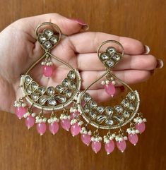 Beautiful and high quality Pink Kundan Earrings with gold detailing. These earrings add a Royal touch to any outfit. If you are looking for a pair of earrings that really make a statement, these are the ones for you! 

In case of any queries, please feel free to contact us and we will be happy to assist you. 
Happy shopping! Gold Dual-tone Kundan Earrings, Dual-tone Kundan Earrings For Gifts, Traditional Dual-tone Kundan Earrings, Dual-tone Earrings For Navratri Celebration, Temple Jewelry Chandbalis With Pierced Ears In Kundan, Dual-tone Chandbali Earrings For Festive Occasions, Bollywood Style Earrings For Navratri With Pierced Ears, Dual-tone Earrings For Diwali Celebration, Festive Dual-tone Bridal Earrings For Diwali