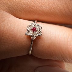 July Ruby Birth Flower Ring Material: Choose from Solid 14k Yellow Gold, 14k White Gold, 14k Rose Gold, or 925 Sterling Silver. Stone: 2 mm genuine AA grade brilliant cut Band: Solid 1.3 round band Water Lily Flower: Ruby Ring Water lily – Symbolize pleasure and peace Ruby Birthstone: The ruby has become a symbol of love and commitment. It was once thought to protect against misfortune and illness. ✿ This piece comes in a lovely Amelia Ray Jewelry gift box. My pieces are ideal gifts for birthday Water Lily Ring, Water Lily Flower, Lily Ring, Ruby Birthstone, Birth Flower, Water Lily, Lily Flower, Ruby Ring, Flower Ring