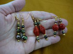 "(Internal #V-283) You are bidding on a beautiful, handmade, Cloisonné beaded necklace and earrings set. NECKLACE: Black cloisonne and Red cinnabar beads Huge 40 mm bottom bead (black cloisonne round), Four 35 mm round black cloisonne beads, Four 30 mm cinnabar round beads, Two \"Pumpkin\" shaped red cinnabar beads Black cloisonne round 10, 8 and 8 mm graduated; six diamond shaped 19x10 mm red cloisonne beads with brass spacer beads 8 and 5 mm Length: 32\" 3 pairs FRENCH WIRE EARRINGS: 1) Three Traditional Festive Earrings With Faceted Beads, Traditional Gold Earrings With Faceted Beads, Traditional Gold Beaded Earrings As Gift, Traditional Faceted Beads Earrings For Gift, French Wire Earrings, Single Bead, Long Beaded Necklace, Set Necklace, French Wire