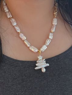 This stunning necklace comes with an eye-catching, natural baroque pearl Christmas tree pendant. Handmade in rare style, it makes a perfect holiday gift that will be cherished for years to come. Wear it to add a sophisticated touch to your everyday look. Handmade Gift Ship from: California Measurement：24*34MM Materials: Freshwater pearls,14K gold filled,nice gift box included Unique Pearl Necklace With Pearl Charm As A Gift, Handmade Baroque Pearl Necklace Gift, Handmade Baroque Pearl Necklace For Gift, Handmade Pearl Pendant Necklace Gift, Gift Baroque Pearl Necklace, Pearl Christmas Tree, Pearl Christmas, Tree Pendant, Stunning Necklace