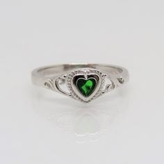 Vintage Sterling Silver Emerald Heart Filigree Ring ...Marked 925...Total of weights 1.7grams...Size 7...Measure of Face 6.6MM...It's in very good condition. Heart-shaped May Birthstone Ring, Silver Heart-shaped May Birthstone Ring, Heart-shaped May Birthstone Ring For Promise, Heart Shaped May Birthstone Promise Ring, Classic Sterling Silver Heart-shaped Engraved Ring, Classic Heart-shaped Sterling Silver Engraved Ring, Classic Sterling Silver Heart Engraved Ring, Sterling Silver Heart Rings With Emerald, Classic Heart-shaped Engraved Sterling Silver Ring