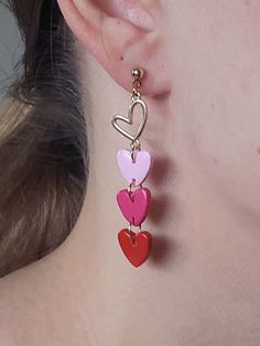 https://purplebeestudio.etsy.com Dainty earrings in bright red, raspberry and pink. Handcrafted from polymer clay with brass heart charm, ear posts and backs. The earrings are very light and comfortable to wear. Nice gift for your loved ones. All my earrings are handcrafted, sanded, buffed and polished with two layers of special semi-gloss varnish for better surface protection. Product care:  - To ensure the product quality and durablility, avoid contact with water, lotion, perfumes and household cleaners and chemicals. - You can clean the products with a slightly damp soft fabric.  - Sharp objects can damage the clay surface. - When not in use, store in a dry, seperate box. Thank you for visiting my shop! If you have any special requests, I'll be happy to do my best to accommodate. Cute Dangle Earrings For Valentine's Day, Playful Red Drop Earrings, Red Dangle Earrings For Valentine's Day, Valentine's Day Red Dangle Earrings, Playful Red Dangle Jewelry, Playful Red Earrings For Pierced Ears, Playful Red Pierced Earrings, Cute Drop Earrings For Valentine's Day, Cute Multicolor Earrings With Heart Charm