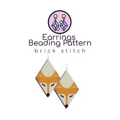 the earrings are made out of fabric and have a fox design