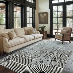 a living room filled with furniture and lots of windows