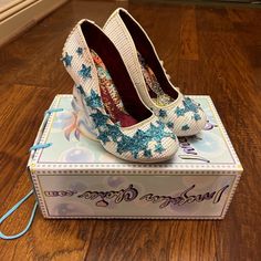 Holy Cannoli! These Are The Ultimate Princess Heels. Only Worn To Try On, Still Got The Box, Was Never Cool Enough To Pull Them Off. Now I’m Definitely Not. Super Sad To See The Bbs Go, But Someone Deserves To Wear Them! White Heels With Rainbow Embroidery, Glittery Blue Stars, And A Unicorn Head Block Heel! Not To Mention The Interior And Bottom Of The Shoes Are Super Pretty Too, These Are A Literal Work Of Art. True Size 7. Iridescent Shoes Heels, Mermaid Heel Fairy Tail, Star Heels, Rainbow Open Toe Synthetic Heels, Princess Heels, Irregular Choice Shoes Blue, Holy Cannoli, Irregular Choice Shoes Pink, Rainbow Embroidery