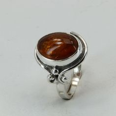 This is a beautiful Baltic Amber Ring in 925 Sterling Silver. The Amber is right from the capital of amber and silver: the city of Gdańsk / Danzig in Poland. The ring is made out of solid 925 Silver and there is no nickel or other substances causing most allergies in the silver. This makes the ring hypo allergenic. Size of the Amber 1.3 x 0.9 cm 0.51 x 0.35 inch Weight of the Ring 6.0 grams 0.21 ounces You will receive the item in a gift box - perfect to surprise someone or yourself. Usually we ship on the same day we receive the payment for the order. We want you to be happy with your purchase. If you do not like what you bough can send it back and we will refund you the money. Please do not hesitate to contact us so we can solve any issue you might have. Nothing is more important than a Amber Ring, Baltic Amber, Cognac, Amber, 925 Silver, Jewelry Watches, Jewelry Rings, Fine Jewelry, 925 Sterling Silver