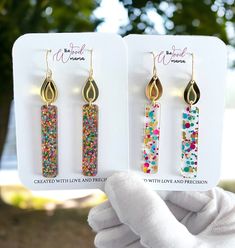 Birthday Candle long earrings make for a unique gift or a treat to yourself, embodying the spirit of celebration and joy. Whether it's a milestone birthday or a simple celebration, these earrings are a delightful way to commemorate special moments. Crafted from premium acrylic glitter, mirror acrylic, and stainless steel, these earrings offer a lightweight yet durable design. Their dimensions, measuring at 2.7" from hook and 0.5" wide, ensure a perfect balance of statement and subtlety. Experien Trendy Earrings For Anniversary And Mother's Day, Multicolor Hypoallergenic Jewelry For Birthday, Hypoallergenic Multicolor Jewelry For Birthday, Trendy Hypoallergenic Jewelry For Parties, Gold Earrings For Mother's Day Party, Trendy Earrings For Mother's Day Gift, Trendy Adjustable Earrings For Birthday, Hypoallergenic Dangle Jewelry For Birthday, Hypoallergenic Jewelry For Mother's Day Party