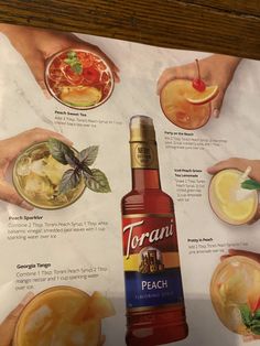 an advertisement for torani's peach cocktails with hand holding glasses filled with drinks