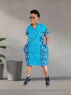 This Beautiful attire is handmade with love and perfect for any event as it can be dressed up with accessories or worn as casual. It provides a unique and visually captivating attire crafted for comfort! It enables you to make a bold fashion statement while embracing the beauty and diversity of vibrant African prints.  Durable lasting quality Ankara cotton. Cotton Short Sleeve Dress For Casual Wear, Summer Maxi Dress In Ankara Fabric With Short Sleeves, Casual Cotton Maxi Dress With Short Sleeves, Fitted Batik Print Dress For Spring, Traditional Cotton Maxi Dress With Short Sleeves, Traditional Short Sleeve Cotton Maxi Dress, Casual Blue Dress With Batik Print, Blue Cotton Batik Print Dress, Cotton Batik Print Short Sleeve Maxi Dress