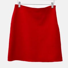 A Simple A-Line Mini Skirt In A Soft And Fluid Bright Scarlet Double-Faced Wool, With An Invisible Zipper Closure At The Left Hip. Size: Unknown; See Measurements. Condition: Excellent; Minor Pilling At Waist, Size And Care Labels Removed. Approximate Measurements (Laid Flat): Waist: 14.25“ (36 Cm) Hip: 18.25“ (46 Cm) Length: 18.5“ (47 Cm) Composition: 100% Wool; Lining: Fells Like Cupro/Acetate. Classic Red Skirt, Elegant Red Mini Skort, Red A-line Skirt For Formal Occasions, Formal Red A-line Skirt, Classic Red Winter Skirt, Wool Mini Skirt, A Line Mini Skirt, Weekend Max Mara, Invisible Zipper