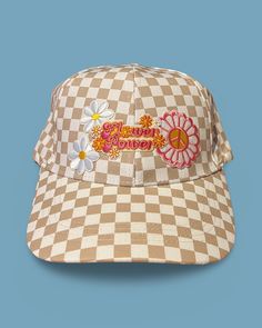 Upgrade your spring and summer style with our Flower Power Checked Cap. This white and tan checkered baseball cap features floral and heart patches for a playful yet stylish look. Get ready to rock your flower power vibes with this quirky and fun accessory! A Cactus Jane Original, made in house at our Laguna Beach store front Vintage Baseball Cap With Curved Visor For Spring, Trendy Spring Hats With Curved Visor, Trendy Curved Visor Hats For Spring, Trendy Spring Hat With Curved Visor, Summer Retro Baseball Cap, Retro Spring Baseball Cap With Curved Brim, Retro Summer Baseball Cap, Retro Curved Brim Baseball Cap For Spring, Retro Visor Hats For Spring