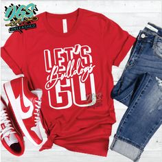 a t - shirt that says let's birthday go on it next to jeans and sneakers