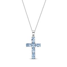 This gemstone cross necklace is a shimmering reflection of her faith. Six bright oval-cut Swiss blue topaz come together to create this touching pendant. Crafted in sterling silver, this pendant suspends along an 18-inch box chain that secures with a spring ring clasp. Blue Cross Necklace, Cross Neckless, Sterling Silver Cross Necklace, Christian Necklace, Necklace Clasps, White Necklace, Swiss Blue Topaz, Topaz Stone, Cross Jewelry