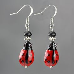 "The cute ladybug drop earrings are handmade using hand painted ceramic beads and crystal glass. Free US shipping. Customers who purchased this item said: \" So super cute and arrived in just a few days! Love this shop!!\" The Length of the earring is 3/4 inches, or 2.0 cm. (excluding the length of hook) ;-) My contact number: 626-379-1904. Please contact me if you would like to order multiples or customize a design for your special event, I will be pleased to give you a discount on a quantity o Czech Glass Earrings As A Gift, Hand-painted Czech Glass Jewelry Gift, Hand Painted Czech Glass Jewelry Gift, Hand Painted Czech Glass Jewelry For Gift, Whimsical Red Hand Painted Jewelry, Cute Hand Painted Red Jewelry, Cute Red Hand-painted Jewelry, Cute Red Hand Painted Jewelry, Hypoallergenic Czech Glass Earrings For Gift