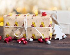 a wrapped christmas present sitting on top of a wooden table