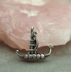 Vintage charm or pendant Of a Viking ship No obvious markings, but has tested as silver Weighs 3.4g Measures approximately, including fixed attachment ring 2.2cms (0.86") high 2.3cms (0.9") long 1.4cms (0.55") wide  In good condition, with some signs of light general age and tarnishing Items that are polished before sending, may have a different appearance to that shown in photos, especially if quite tarnished Please see photos, note colours may vary by screen monitor, more images and informatio Viking Ship, Previous Life, Uk Shop, Vintage Charms, Silver Charms, Vintage Silver, Charm Pendant, Vikings, No Response