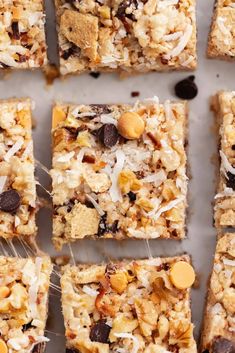 several squares of granola bars with nuts and chocolate chips