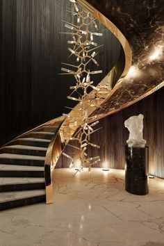 an elegant staircase in a building with marble floors