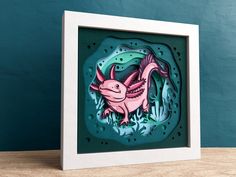 a card with an image of a pink fish in the water on it's side