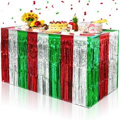 an image of a buffet table with food on it and confetti in the background