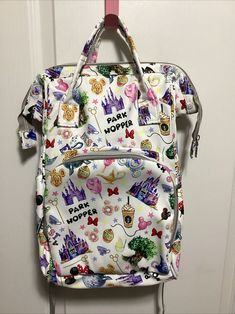 This Disney themed backpack is perfect for any occasion, whether it's a day at the park or a casual outing. With a zip closure and multicolor handle/strap, this large bag is both practical and stylish. The exterior is made of synthetic material and features a pink color with a cartoon theme, making it a great choice for any Disney fan. The bag's interior is lined with beige material and has enough space for all your baby's essentials. It's a great addition to any travel or vacation outfit. This backpack is a must-have for anyone who wants to show off their love for Disney while keeping their baby comfortable and stylish. Used maybe once, excellent condition! Smoke-free, clean home! Disney Diaper Bag, Baby Vacation, Day At The Park, Cartoon Theme, Diaper Bag Backpack, Vacation Outfit, Disney Fan, Large Bag, Vacation Travel