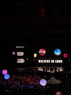 the stage is lit up with colorful lights