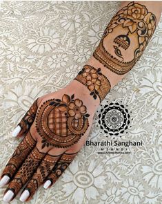 the hand is decorated with henna designs