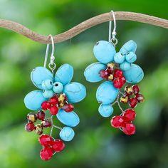 The summer's flowers and berries are the sweetest ones, as Nareerat's newest creation shows in its vibrant colors. Working long hours with howlite and glass beads, the Thai artisan creates these floral cluster dangle earrings featuring a palette of turquoise and crimson hues that will add a charming touch to your day. The accessory also comes with handy sterling silver hooks, allowing you to wear the grace of summer comfortably. Long Hours, Stainless Steel Wire, The Grace, Summer Flowers, Hook Earrings, Jewelry Earrings Dangle, Glass Beads, Blossom, Dangle Earrings