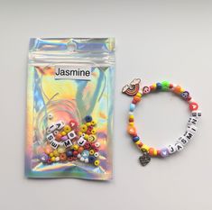 a bag with some beads on it next to a beaded bracelet that says jasmine