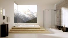 a large bathroom with two sinks and a bathtub in the middle, surrounded by mountains