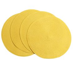 four yellow round placemats on a white background