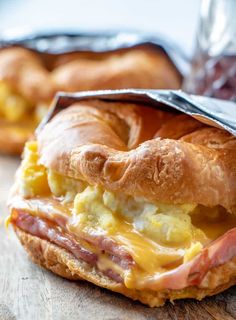 a bagel sandwich with ham and cheese on it