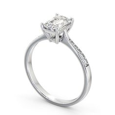 a white gold engagement ring with a princess cut diamond in the center and side stones