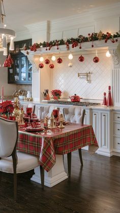 a dining room table set for christmas dinner