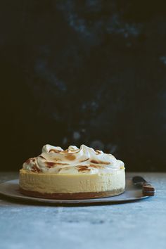 a cake sitting on top of a wooden plate