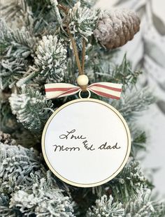 a christmas ornament hanging from the top of a tree