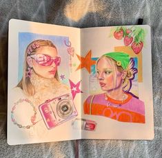 an open book with drawings of two women wearing sunglasses and one holding a camera in her hand