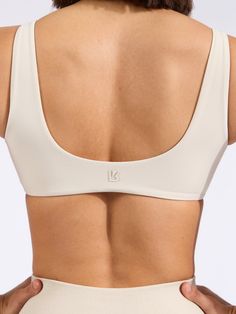 Features: Twist front detailing V-neckline Removable bust pads Details: Fabric: NuBre (Nylon/Spandex) Light Support Level The Twisted Sports Bra is a shortline sports bra with V-shaped neckline that’s sure to highlight all your best features. It is made with our signature NuBre fabric for a soft, second skin feel and high stretch retention. Nylon Scoop Neck Sports Bra For Yoga, Low-cut Sports Bra With Removable Pads, High Stretch Seamless Sports Bra With Wide Straps, Seamless Sports Bra With High Stretch And Wide Straps, Seamless High Stretch Sports Bra With Wide Straps, Seamless Nylon Sports Crop Top, Sporty Seamless Nylon Crop Top, Low-cut Stretch Sports Bra With Medium Bust Support, Low-cut Sports Bra With Medium Bust Support