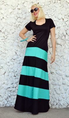 Striped maxi dress made of a perfect mix of jersey and pure cotton. The upper part of this cocktail dress is made of jersey, being very elastic and comfortable and the bottom part of the skirt is made of pure cotton, blending gorgeous the black and the turquoise. This funky party dress will for sure steal the spotlight this summer! Material: jersey - 50% cotton, 50% polyester skirt - 95% cotton, 5% elastane Care instructions: Wash at 30 degrees The model in the picture is size S. Can be made in Fitted Cotton Maxi Dress In Casual Style, Casual Fitted Cotton Maxi Dress, Fitted Cotton Maxi Dress, Spring Cotton Stretch Maxi Dress, Black Long Cotton Dress, Black Cotton Long Dress, Black Cotton Dress With Long Skirt, Cotton Short Sleeve Maxi Dress For Party, Green Long Cotton Dress