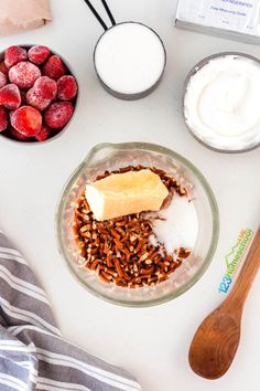 ingredients to make an oatmeal with strawberries, yogurt and granola