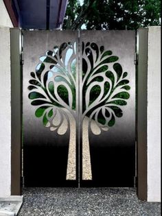 a metal gate with a tree design on it