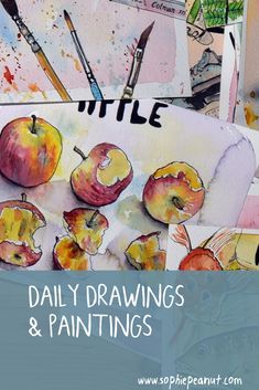 an art project with watercolors and paints on it, including apples and other items