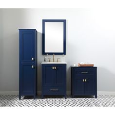 a bathroom vanity with blue cabinets and a mirror on the wall next to a white tiled floor