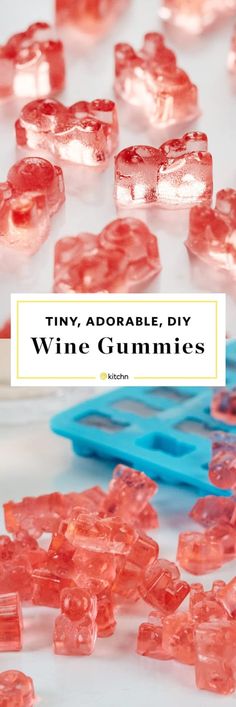 some pink gummy bears sitting on top of a white table with the words tiny adorable, diy wine gummies