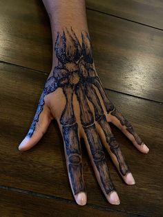 a person's hand with black ink on it