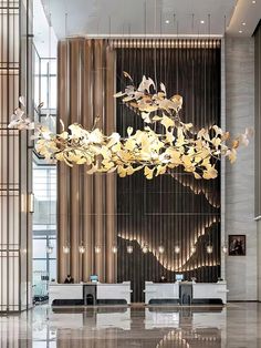 a large chandelier hanging from the ceiling in a lobby