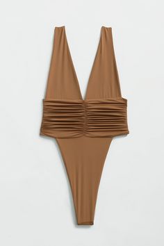 Our best-selling one-piece swimsuit! Equal parts sophisticated and sexy, the Echo One-Piece hugs your body and highlights your hips with a high-legged cut and minimal back coverage. The ruched side detail is met by moderate bust coverage and supportive shoulder straps. Super soft and super stretchy, this one-piece doubles as a bodysuit for an effortless beach-to-bar look. Just like an echo, you will want to repeat this purchase in every shade. Product description Minimal coverage front & back Do Ruched Backless Bodysuit For Pool, Backless Ruched Bodysuit For Pool, Fitted Ruched Backless Bodysuit, One-piece Ruched Bodysuit For Swimming, Ruched Bodysuit For Swimming Beachwear, Ruched One-piece Swimming Bodysuit, Solid One-piece Swimwear With Ruched Back, Ruched Stretch Backless Swimwear, Stretch Ruched Bodysuit For Swimming