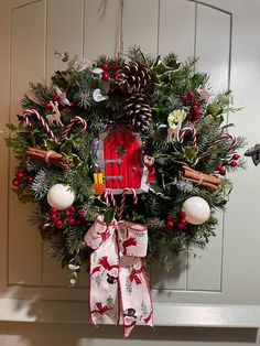 a christmas wreath hanging on the front door