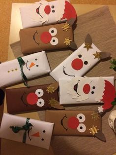 some wrapping paper wrapped in brown and white with snowmen on them, sitting next to a potted plant